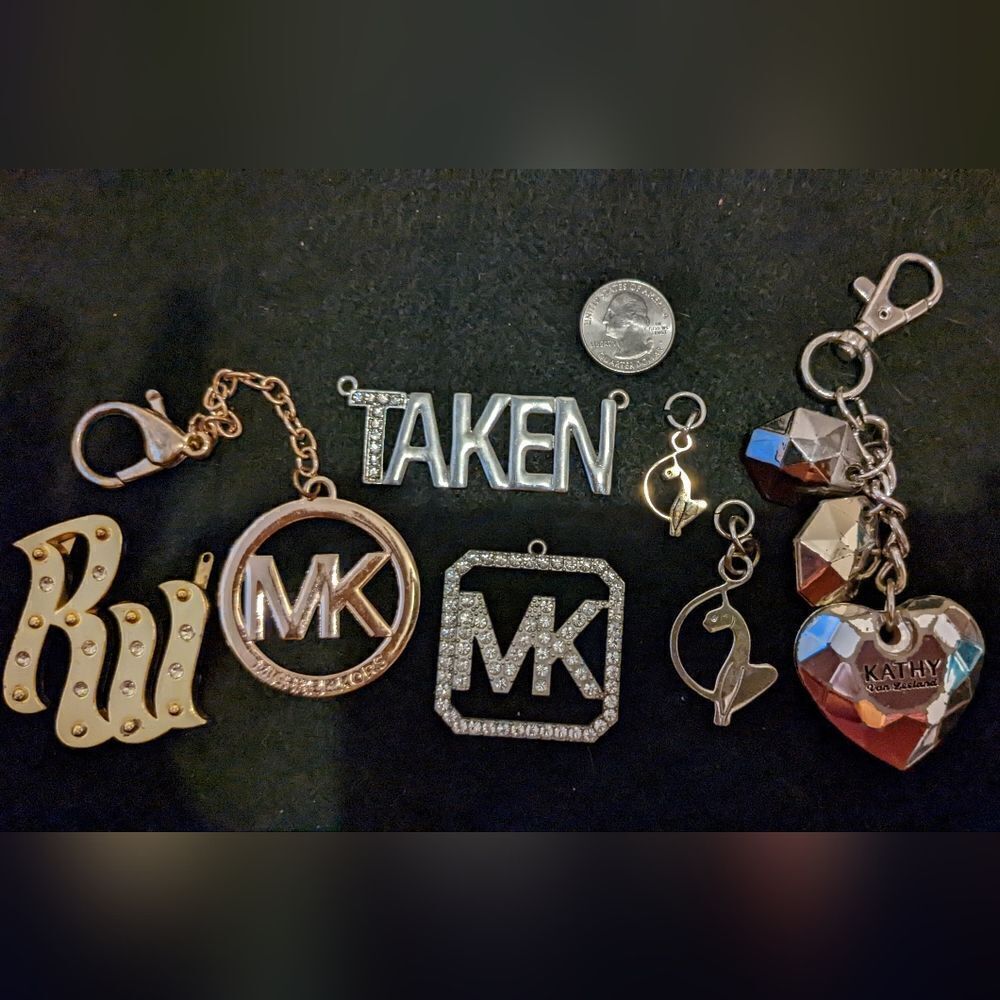 7 different name brand pendants and keychains